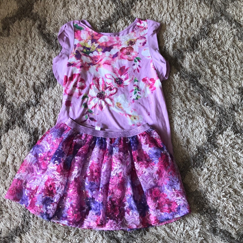 A set of a gently used skirt and shirt set,